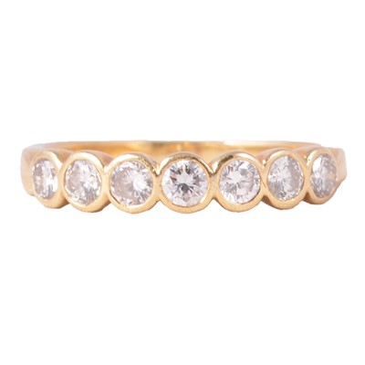 Lot 72 - A diamond seven stone ring.