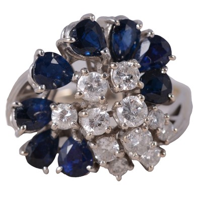 Lot 6 - A sapphire and diamond cluster ring.