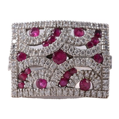 Lot 12 - A ruby and diamond ring.
