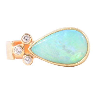 Lot 42 - An opal and diamond dress ring.