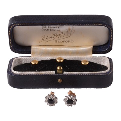 Lot 301 - A set of three gold dress studs, and a pair of sapphire and diamond earrings.