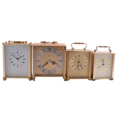 Lot 100 - Four German gilt metal quartz movement table clocks