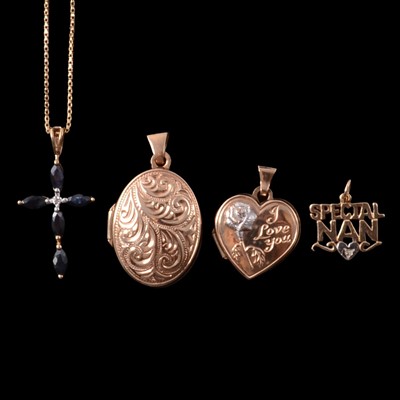 Lot 207 - A sapphire and diamond cross pendant on a chain, two gold lockets, and a gemset Special Nan charm.