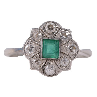 Lot 23 - An emerald and diamond ring.