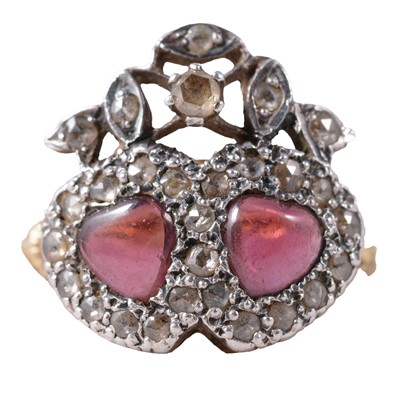 Lot 11 - A ruby and diamond double heart cluster ring.