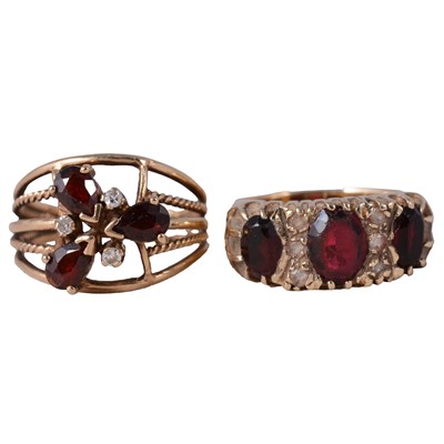 Lot 32 - Two garnet dress rings.