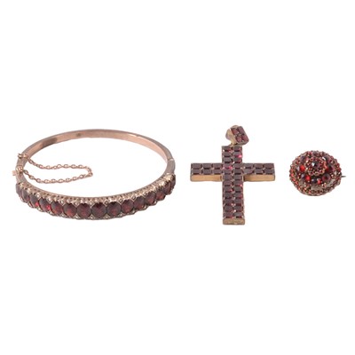 Lot 239 - A garnet and seed pearl half hinged bangle, cross pendant, and garnet brooch.