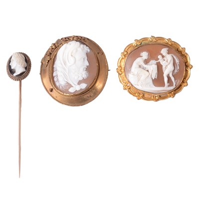 Lot 150 - Two carved shell cameo brooches, and a carved shell cameo stick pin.