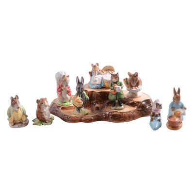 Lot 31 - Nine Beswick Beatrix Potter character figurines, plus a Beswick display stand.