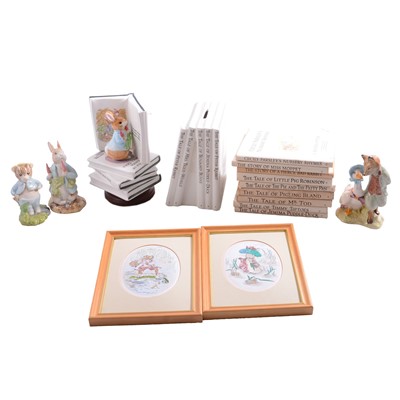 Lot 35 - A collection of Beatrix Potter items inlcuding figurines, books, pictures, etc