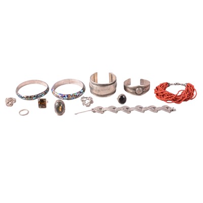 Lot 439 - A collection of white metal bracelets, bangles, rings, and earclips.