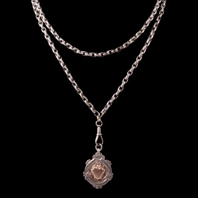 Lot 430 - A white metal guard chain with shield shape fob.