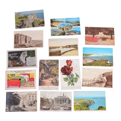 Lot 132 - Eleven boxes of postcards, stamps, folders, and printed images from books.