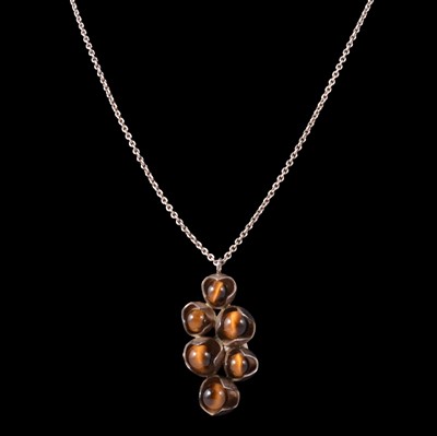 Lot 371 - A Danish silver tiger's eye pendant and chain.