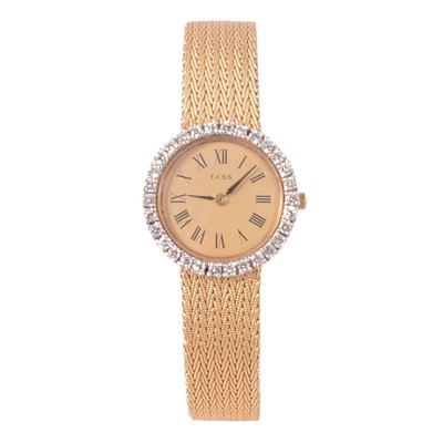 Lot 337 - Tass – a lady’s 9 carat yellow gold diamond set quartz bracelet wristwatch.