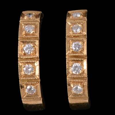 Lot 249 - A pair of diamond hoop earrings.