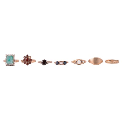 Lot 101 - Seven 9 carat yellow gold rings, some gemset.