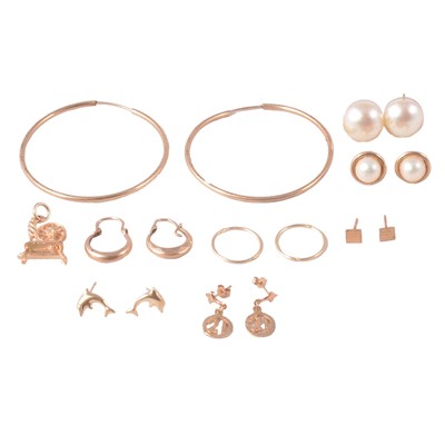 Lot 261 - A collection of gold and yellow metal earrings for pierced ears, and a gold charm.