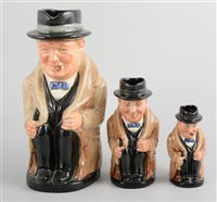 Lot 334 - Set of three graduated Royal Doulton toby jugs,...