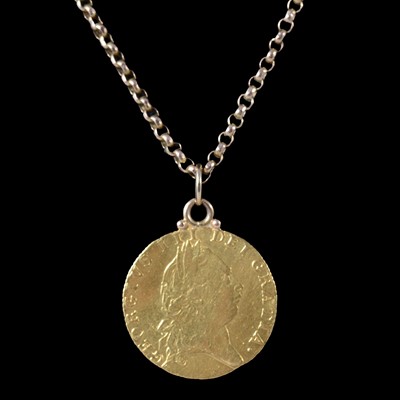Lot 131 - A Gold Spade Guinea on a yellow metal chain.