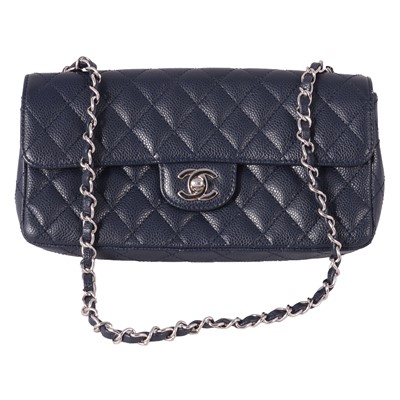 Lot 474 - Chanel - a blue caviar East West single flap handbag.