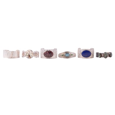 Lot 396 - Twenty gemset silver and white metal cuff bangles, and half-hinged bangles.