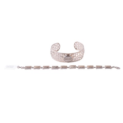 Lot 395 - A meteorite bracelet, and cuff bangle.