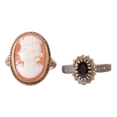 Lot 94 - A sapphire and diamond ring, and a carved shell cameo ring.