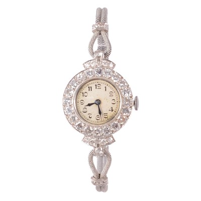 Lot 335 - A 1930s lady's diamond set manual wind bracelet wristwatch.