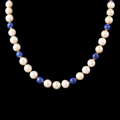 Lot 269 - A cultured pearl and lapis lazuli necklace, and a pair of lapis lazuli earstuds.