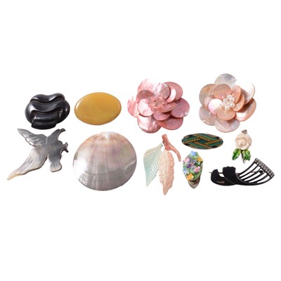 Lot 424 - A collection of costume jewellery brooches, ceramic pins, and ceramic clips.