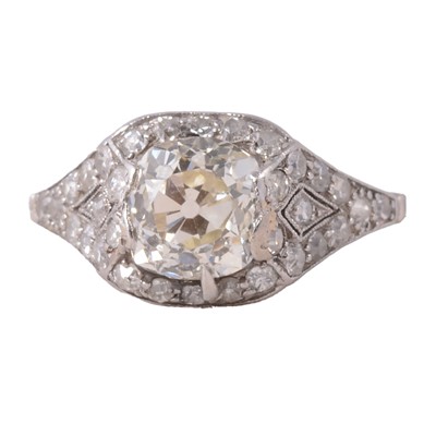 Lot 78 - An old mine cut diamond ring with diamond shoulders.