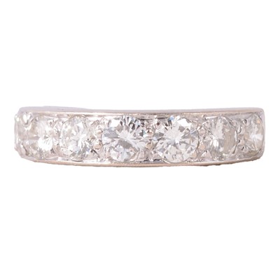 Lot 73 - A diamond half eternity ring.