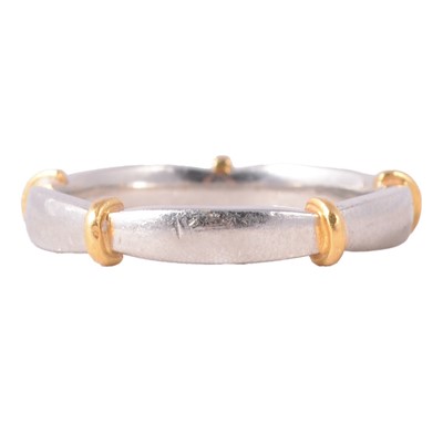 Lot 114 - A platinum wedding band.