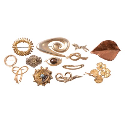 Lot 415 - Twenty-five gilt metal costume brooches, and two brass threepence coin brooches.