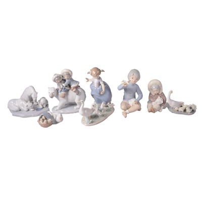 Lot 59 - Six Lladro figures of children, polar bears, and geese, and a similar figure of a boy with plane