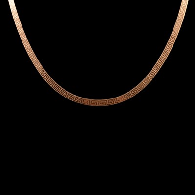 Lot 221 - A yellow metal Greek key design necklace.