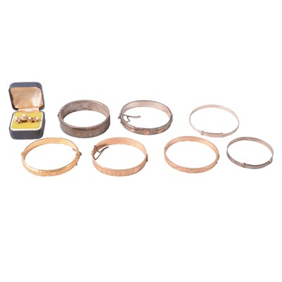 Lot 436 - Two silver bangles, two expanding bangles, three rolled gold, two pairs of earrings.