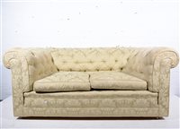 Lot 596 - Chesterfield settee, upholstered in celadon...