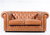 Lot 597 - Two seat Chesterfield settee with saddle...