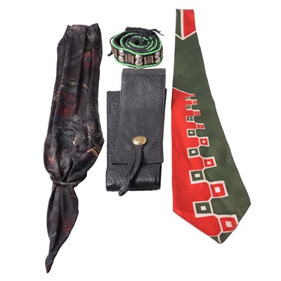 Lot 484 - A collection of belts, tie, gloves, and floral brooches.