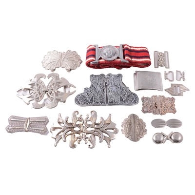Lot 418 - Thirteen silver-plated and metal buckles, and a Royal Army Nursing Corps belt and buckle.