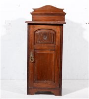 Lot 600 - An Edwardian walnut bedside cabinet, panelled...