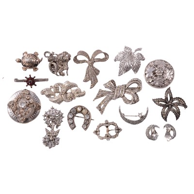 Lot 409 - A paste set white metal buckle, silver, white metal, and other metal brooches.