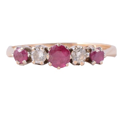 Lot 17 - A ruby and diamond five stone ring.