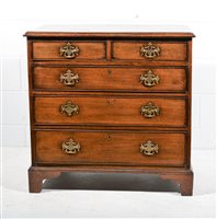 Lot 613 - Georgian oak chest of drawers with mahogany...