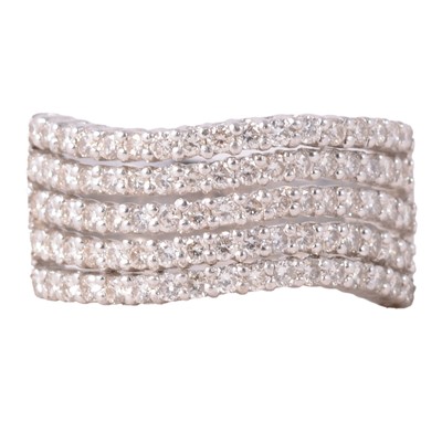 Lot 76 - A broad diamond five row half hoop ring.