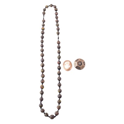 Lot 245 - A carved shell cameo brooch, a tortoiseshell pique brooch, and a ceramic bead necklace.