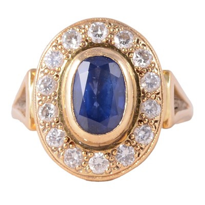 Lot 2 - A sapphire and diamond ring.