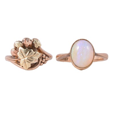 Lot 93 - A yellow and rose metal dress ring, and an opal dress ring.